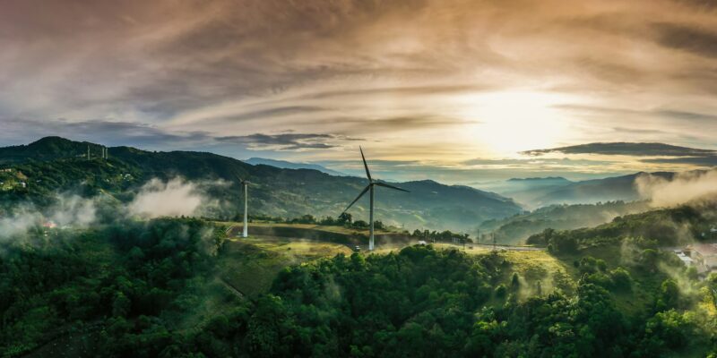 Colorful sunrise and wind turbines in Cartago, Costa Rica.