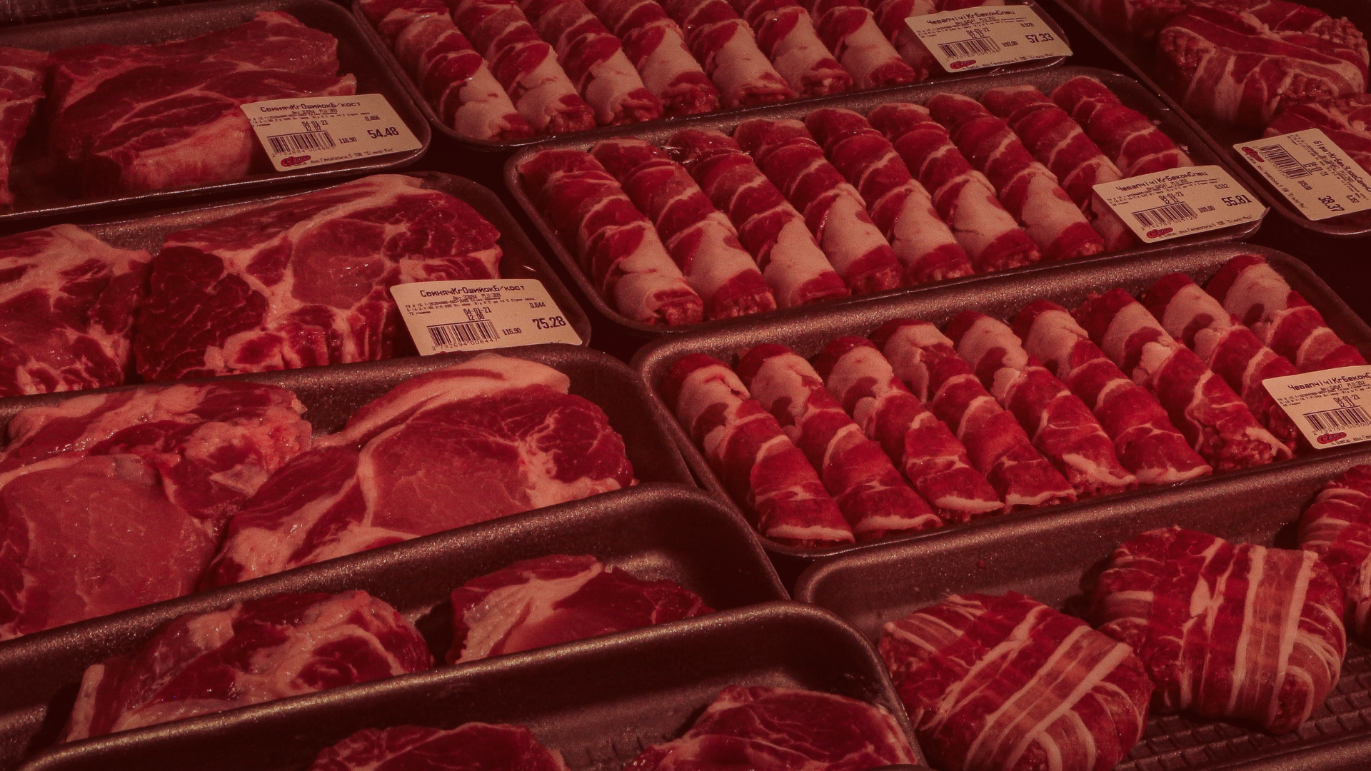 Packets of beef in foam trays at a supermarket